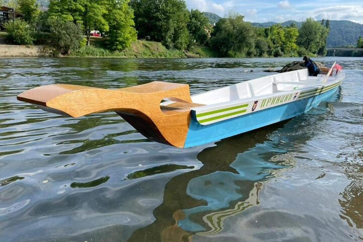 a boat on the water with a person in it