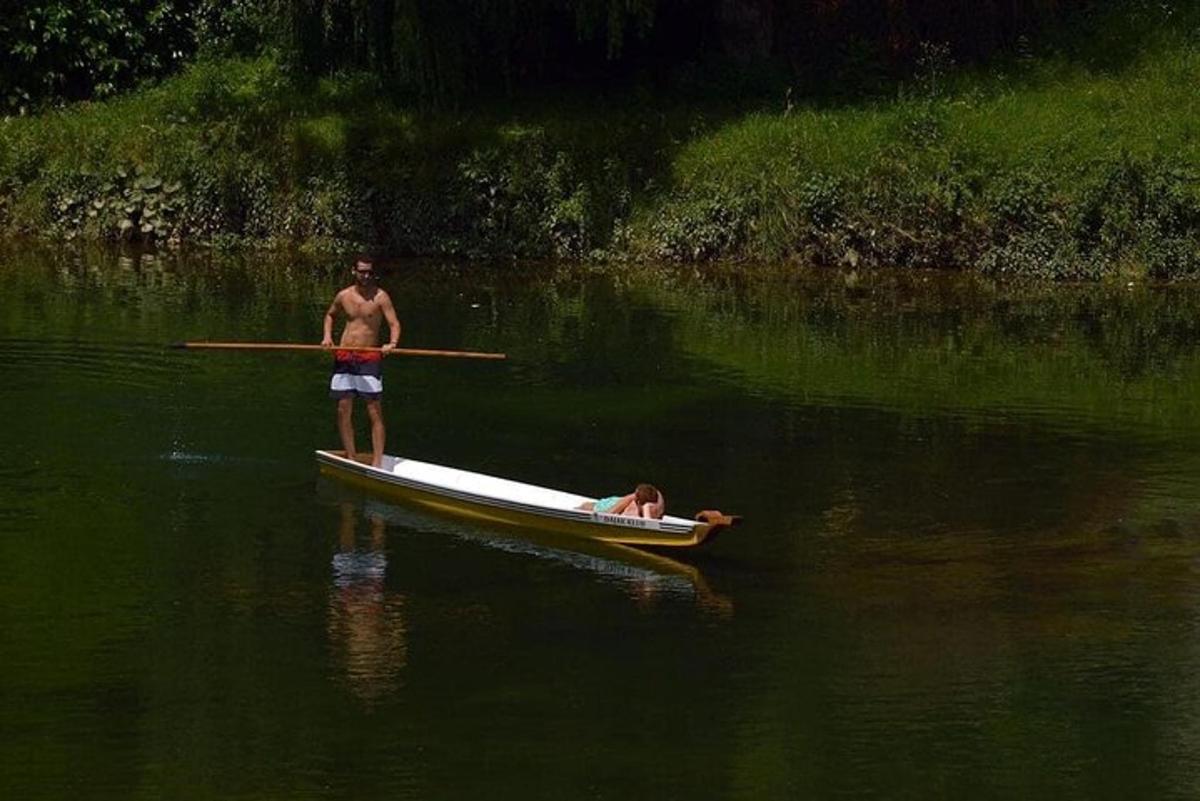 a man is rowing a boat in the water
