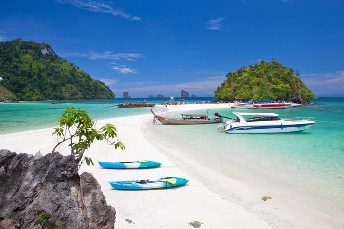 a group of boats on a beach in the ocean