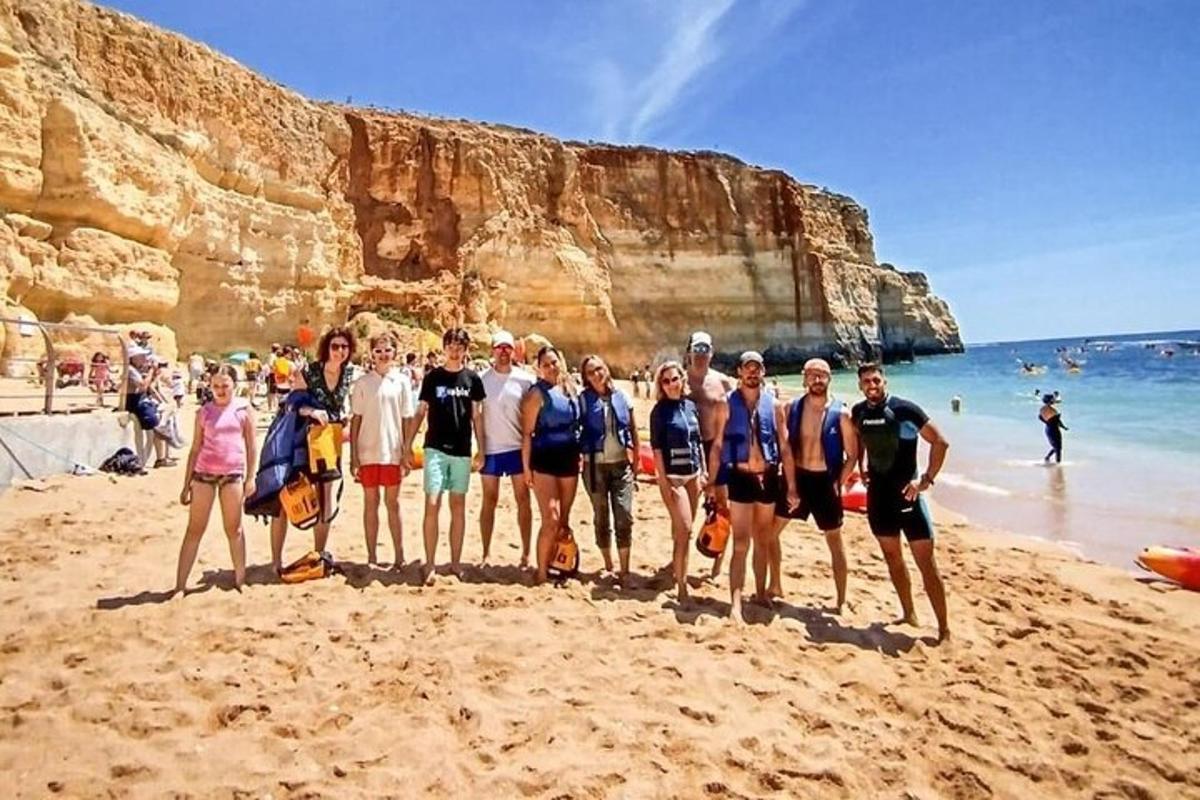 a group of people standing on a beach