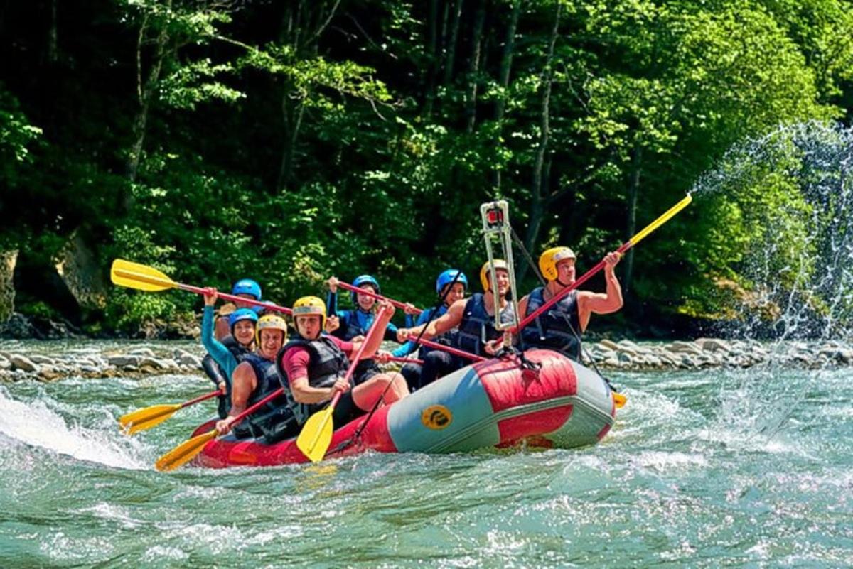 a group of people are rafting on a river