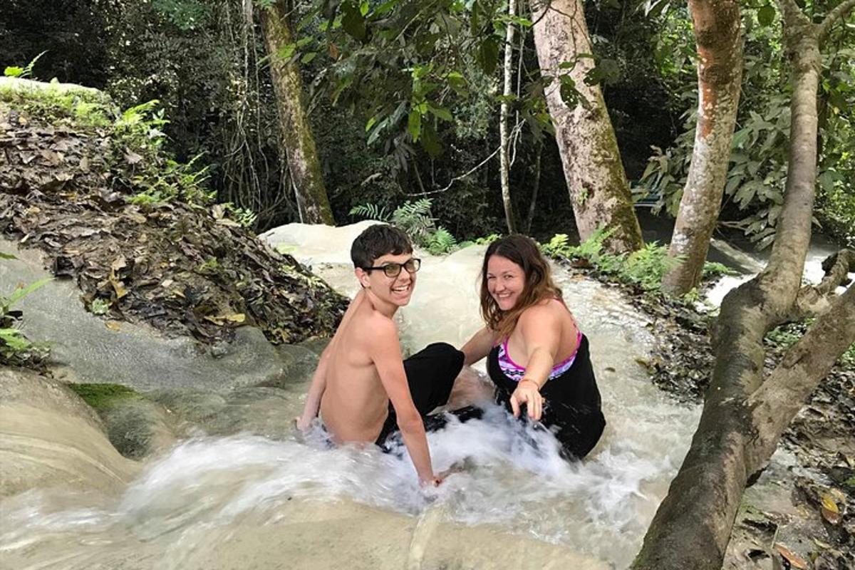 a man and a woman sitting in a river