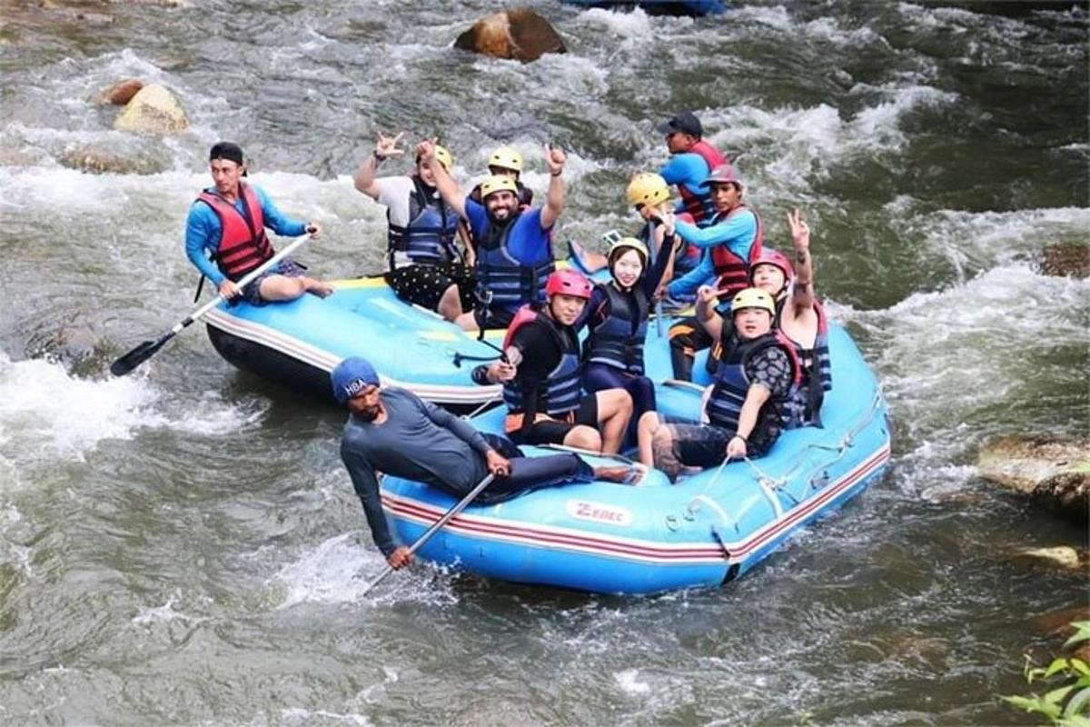 a group of people on a raft in a river