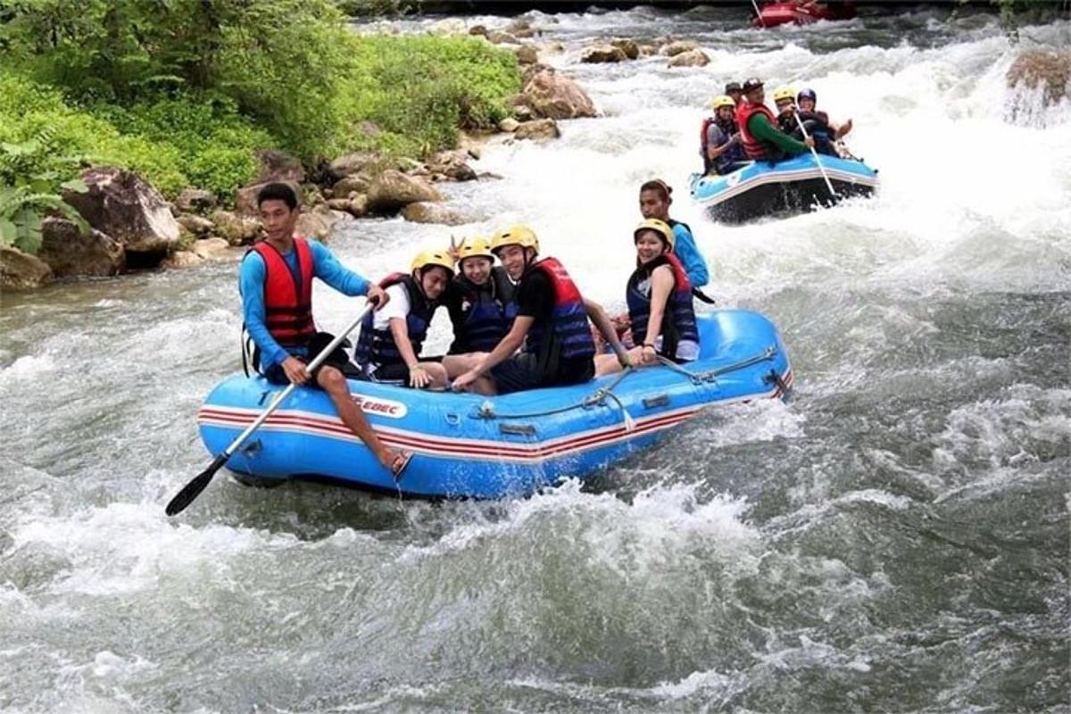 a group of people in a raft on a river