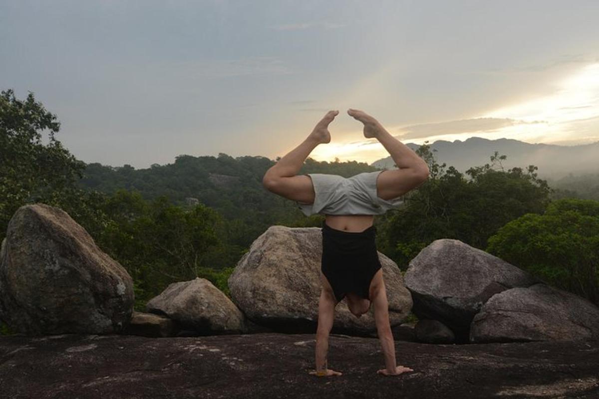 a person doing a yoga pose on top of rocks