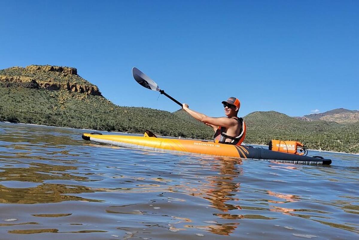 a man in a kayak on the water