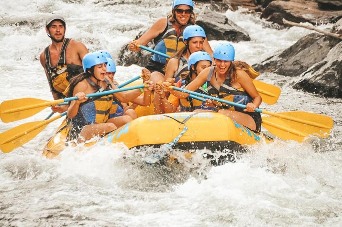 a group of people in a raft on a river