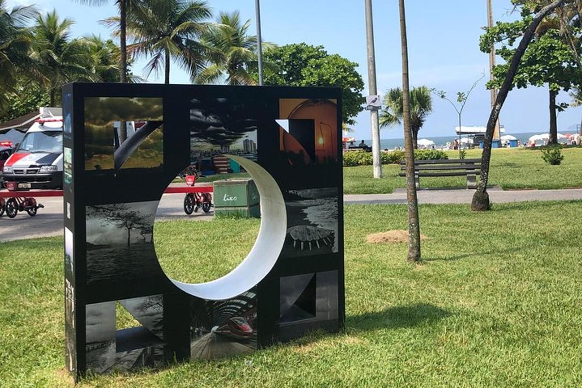 a sculpture in the grass in a park