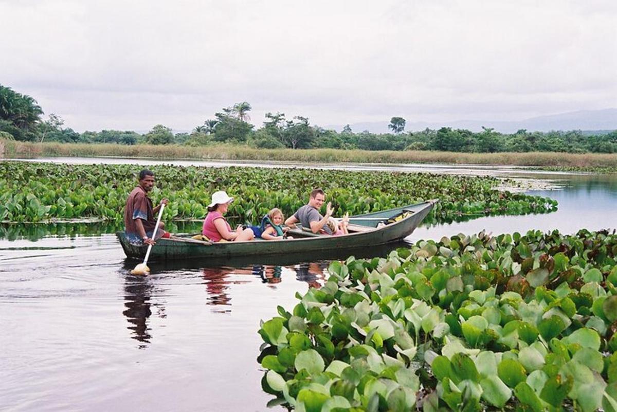 a group of people in a boat on a river