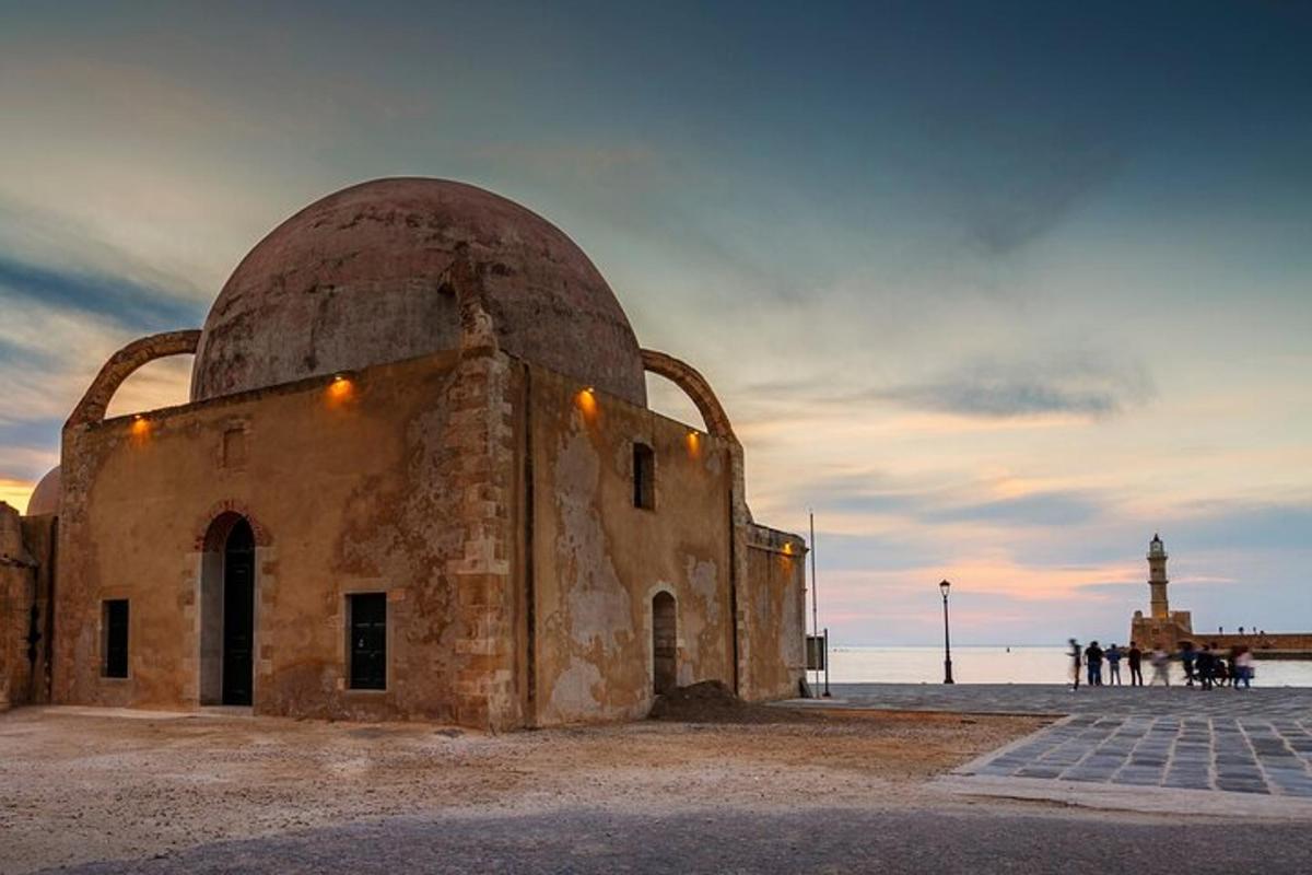 a building with a dome on top of it next to the ocean