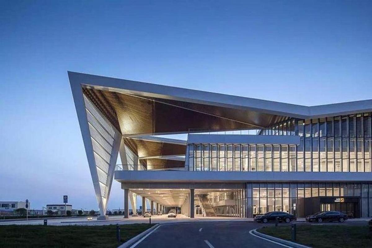 a large building with a road in front of it