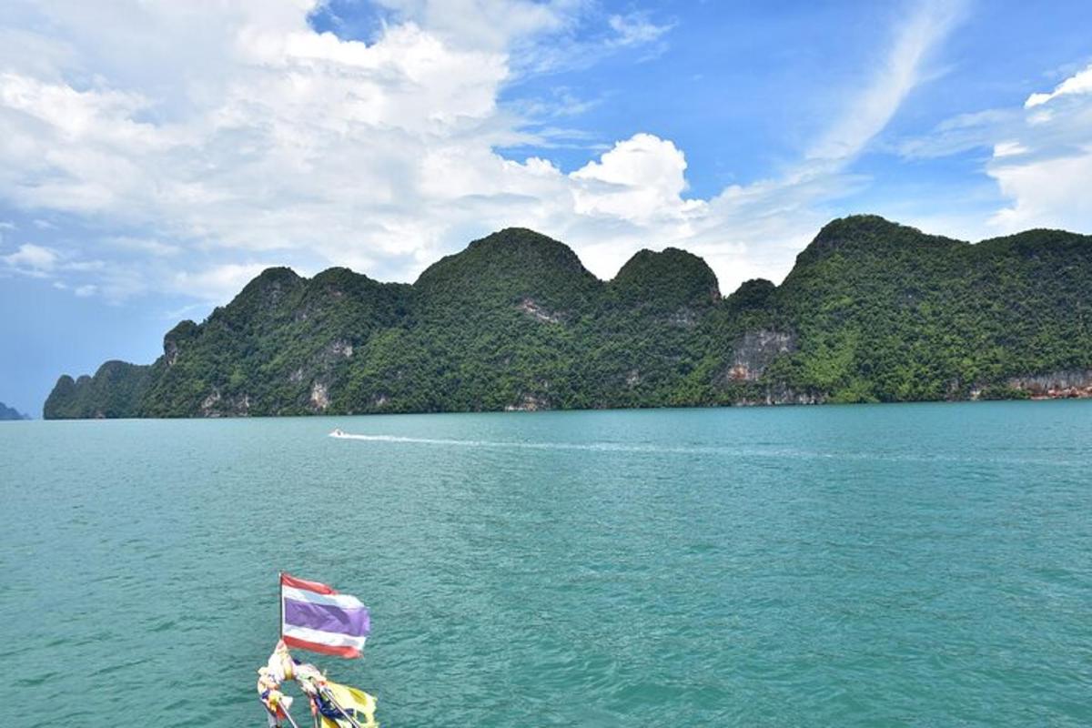 a boat in the water with a flag on it