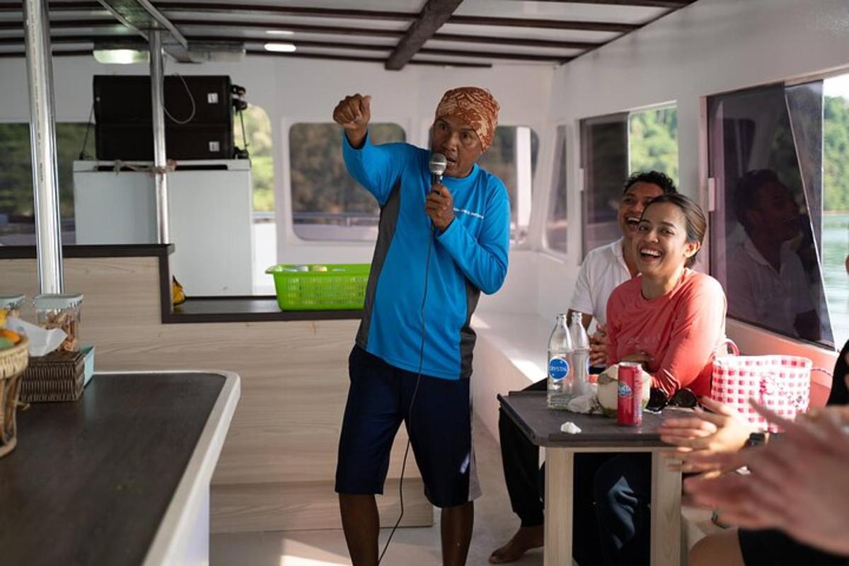 a man holding a microphone in a room with people