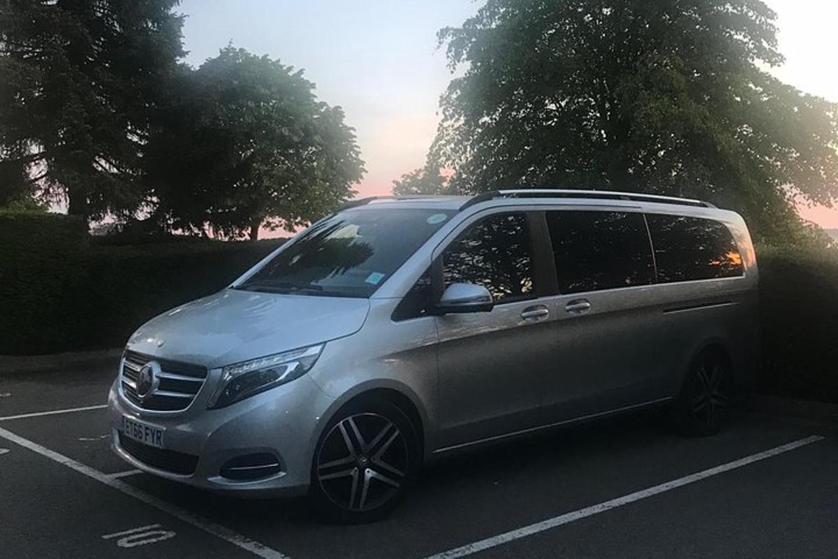 a silver suv parked in a parking lot