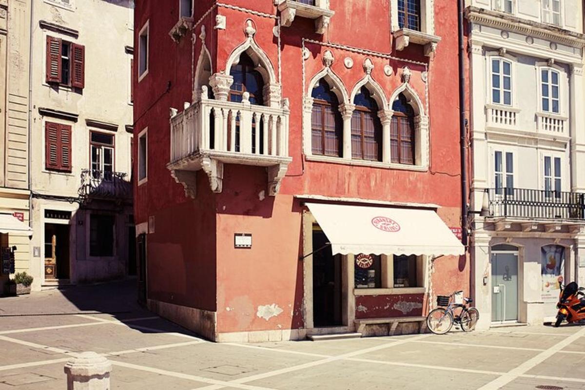 a red building with a white canopy on a street