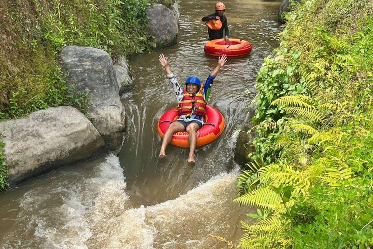 two people are rafting down a river in the rapids