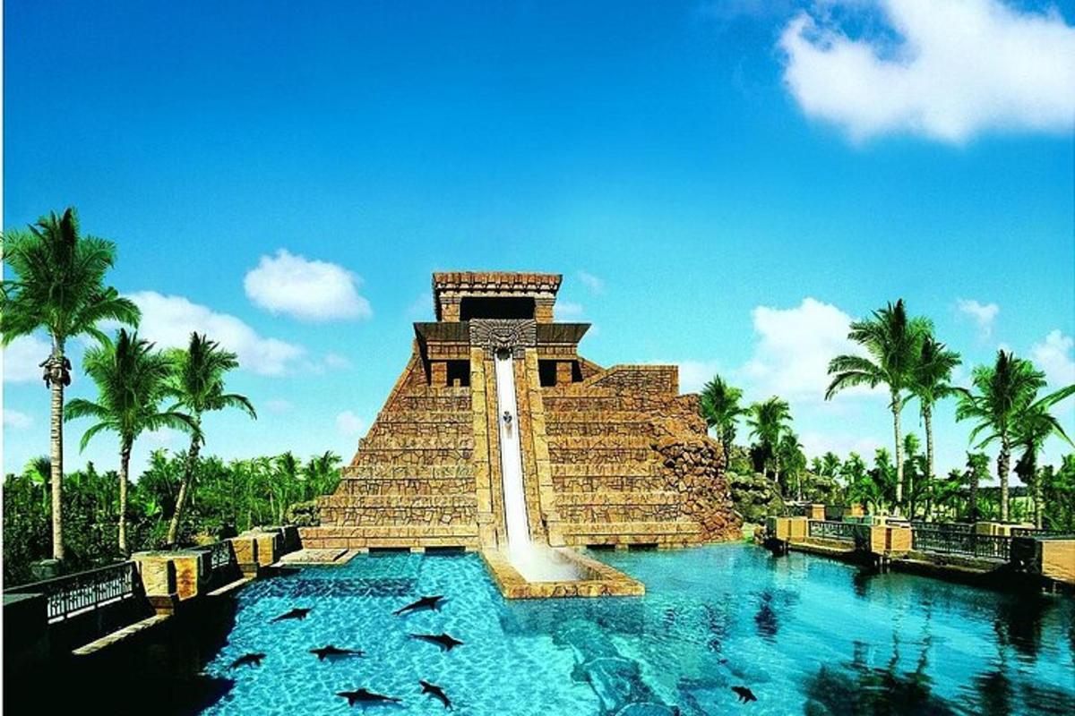 a pyramid in the middle of a pool of water