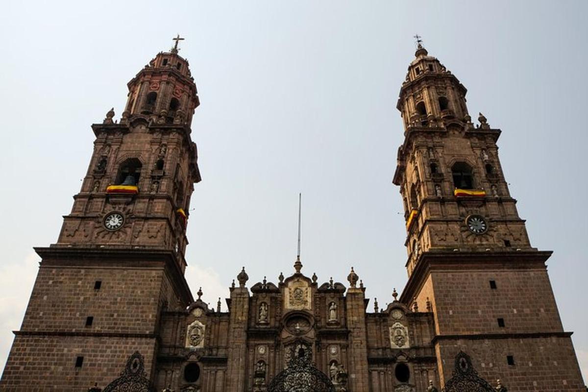 a large building with two towers with clocks on it