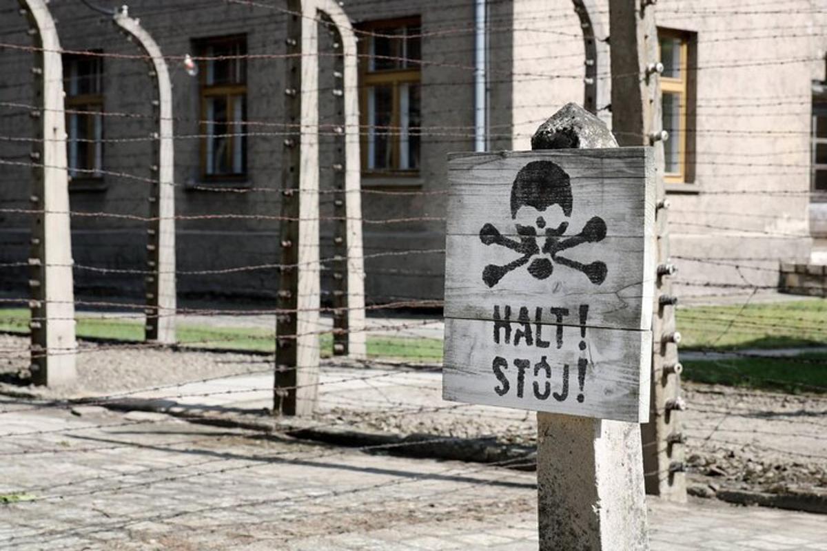 a sign on a pole in front of a building