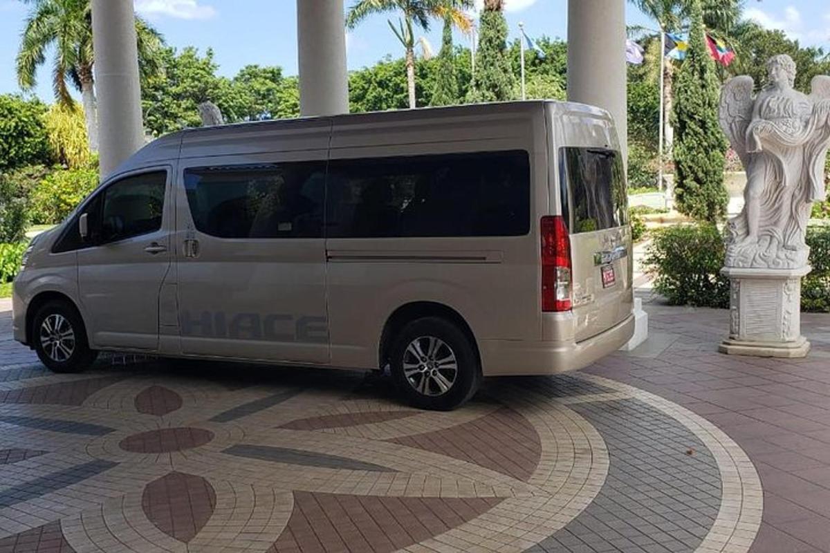 a silver van parked on a sidewalk in a building
