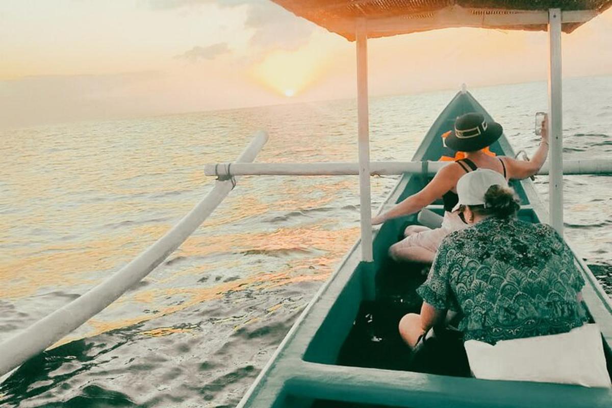 two people on a boat in the water