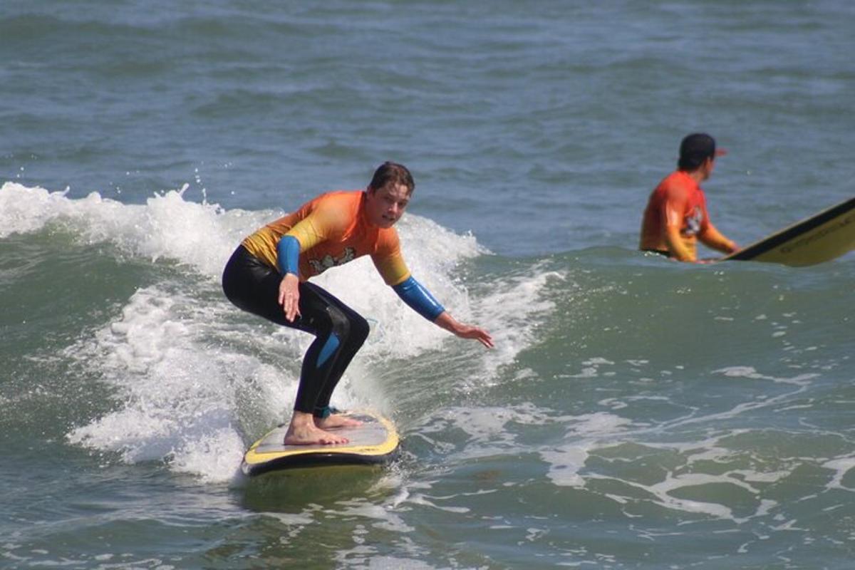 a man riding a wave on a surfboard in the ocean