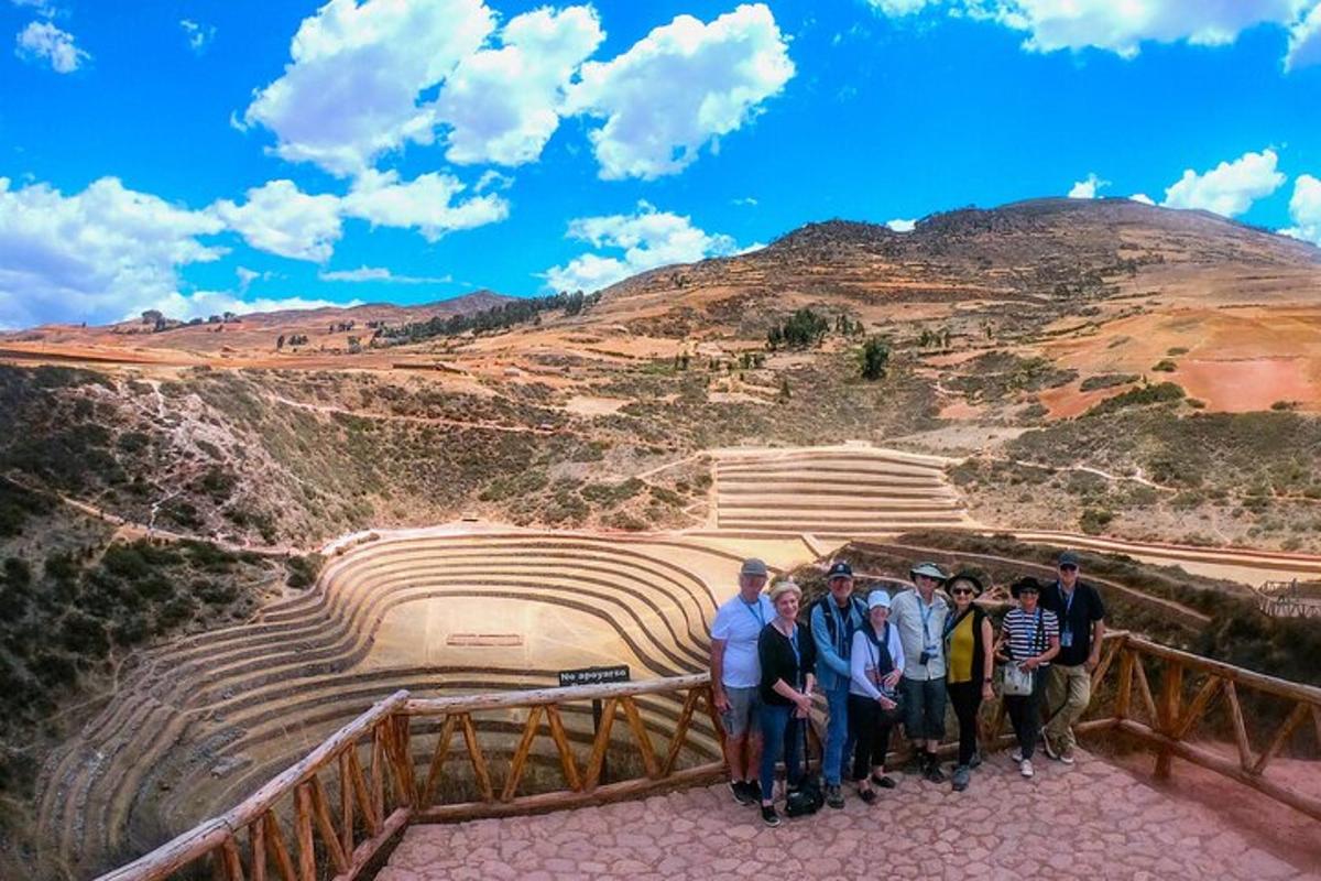 a group of people standing in front of a amphitheater