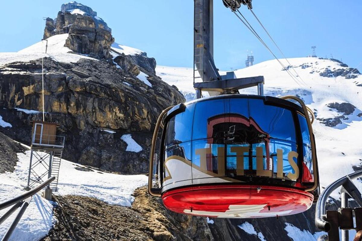 a ski lift with a mountain in the background