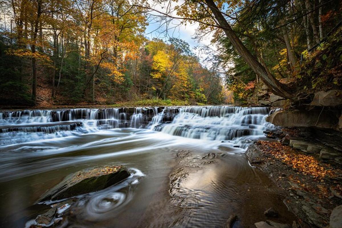 a waterfall in the middle of a river