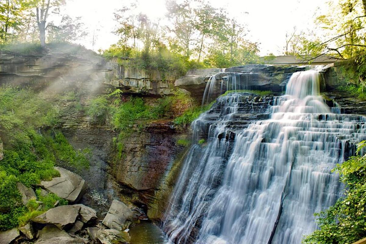 a waterfall on the side of a rocky cliff