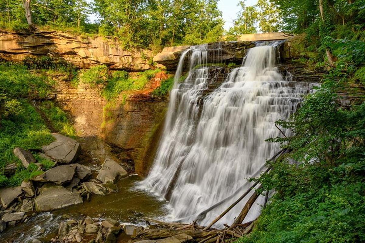 a waterfall on the side of a rocky cliff