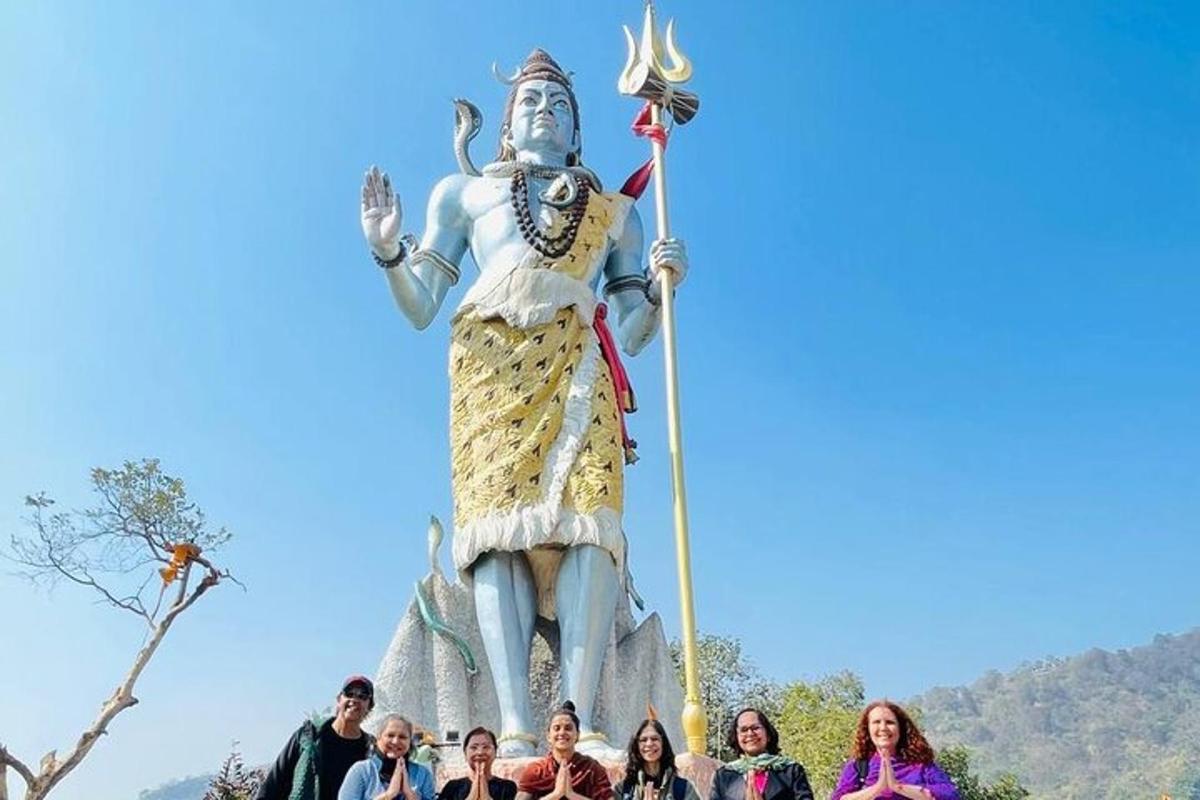 a group of people standing in front of a statue