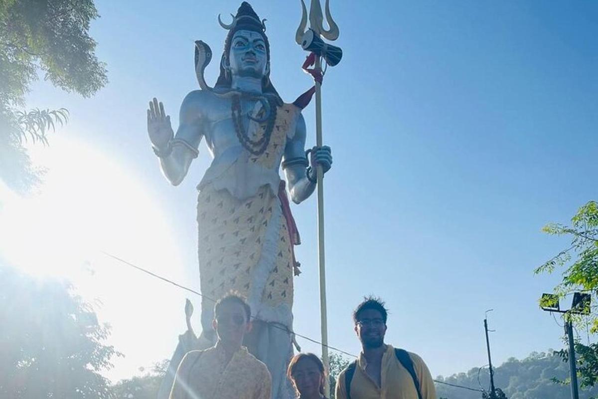 a large statue of a man standing in front