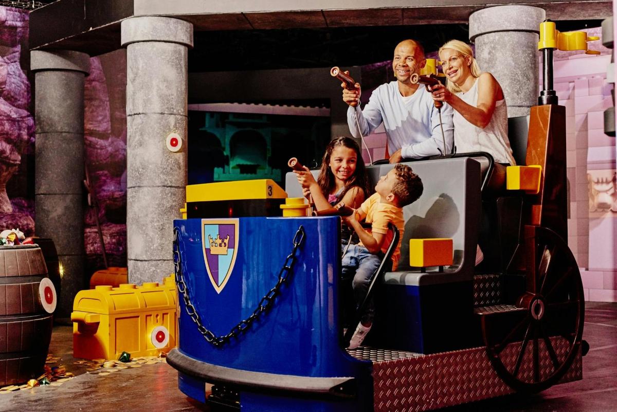 a family posing for a picture on a train