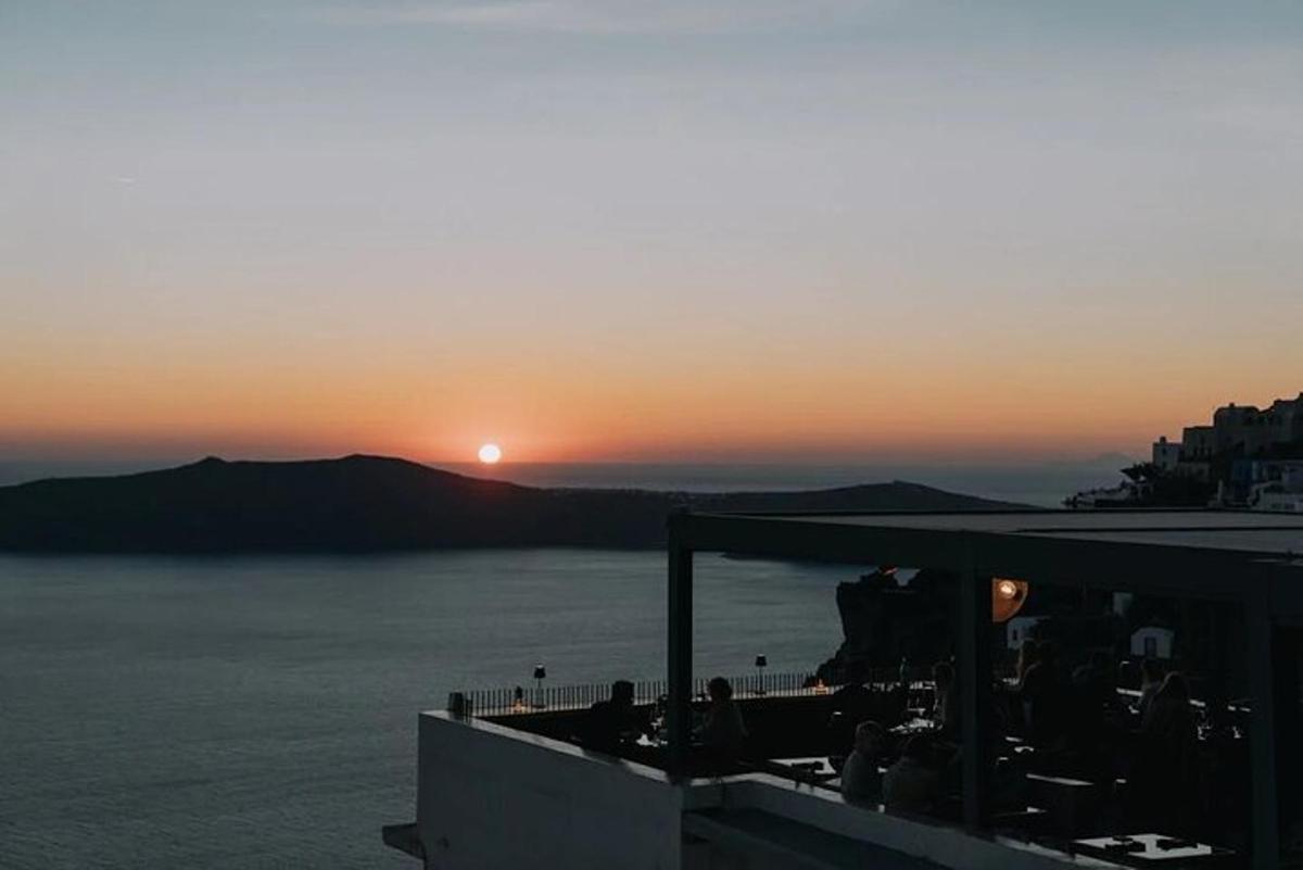 a view of the sun setting over a body of water