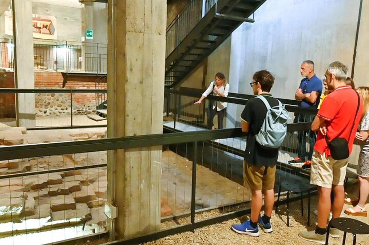 a group of people looking at a exhibit in a museum