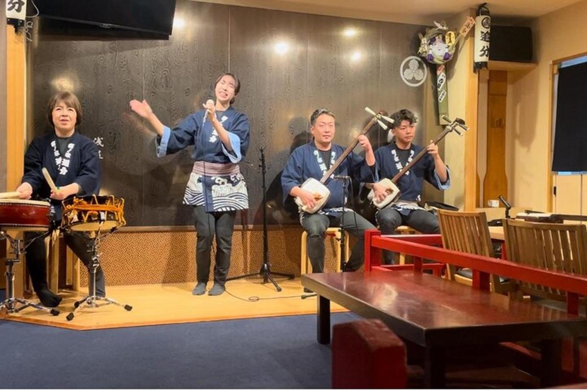 a group of people playing instruments on a stage