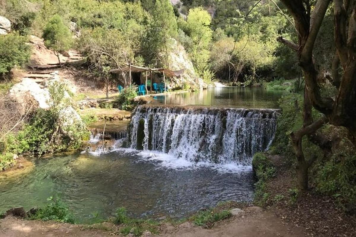 a waterfall in the middle of a river