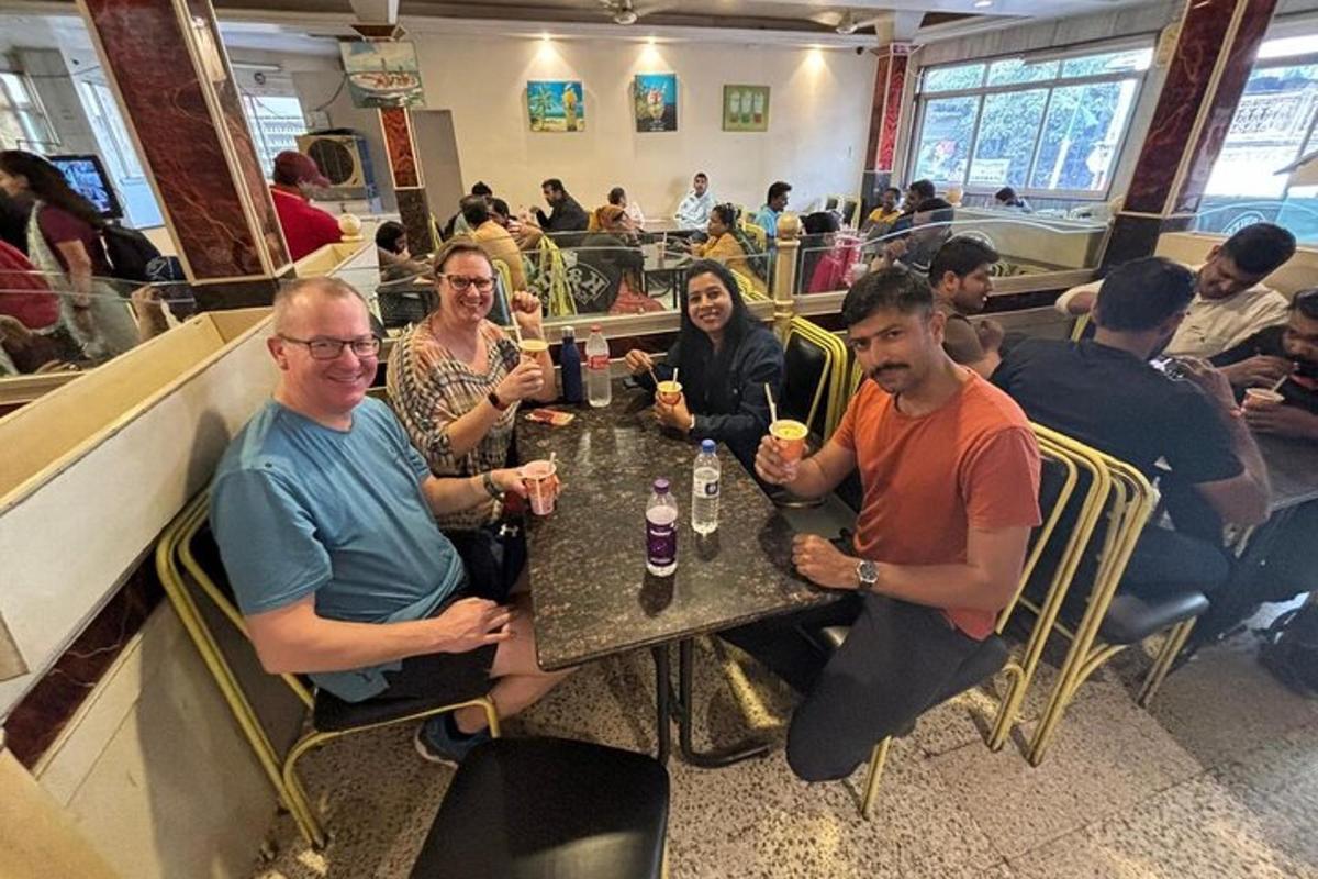 a group of people sitting at a table in a restaurant