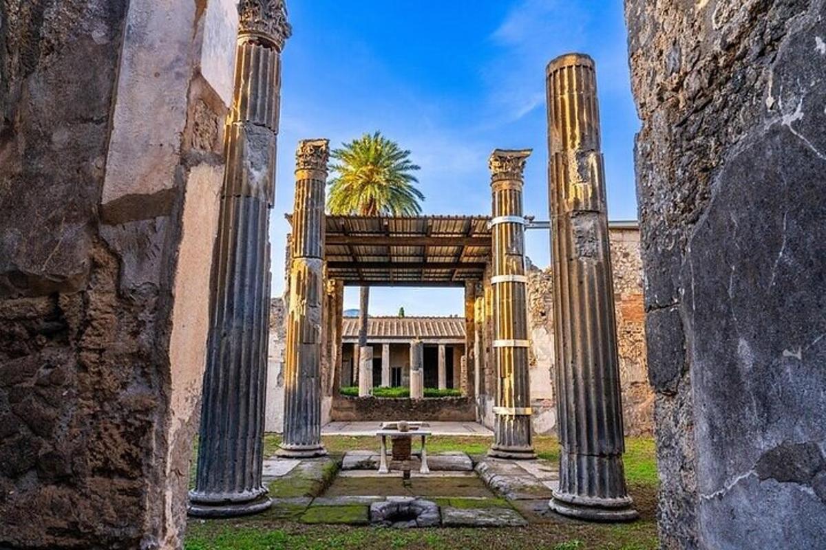 an archway with columns in front of a building