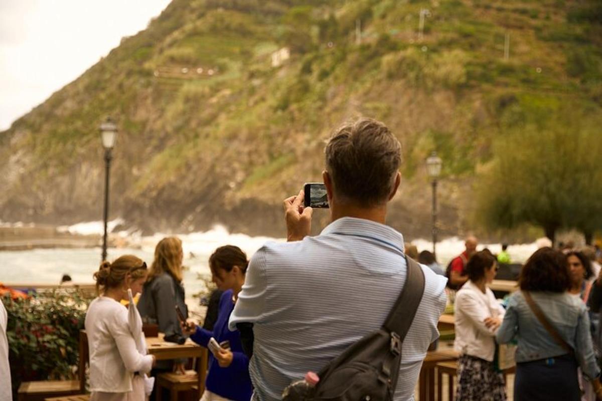 a man taking a picture of a crowd of people