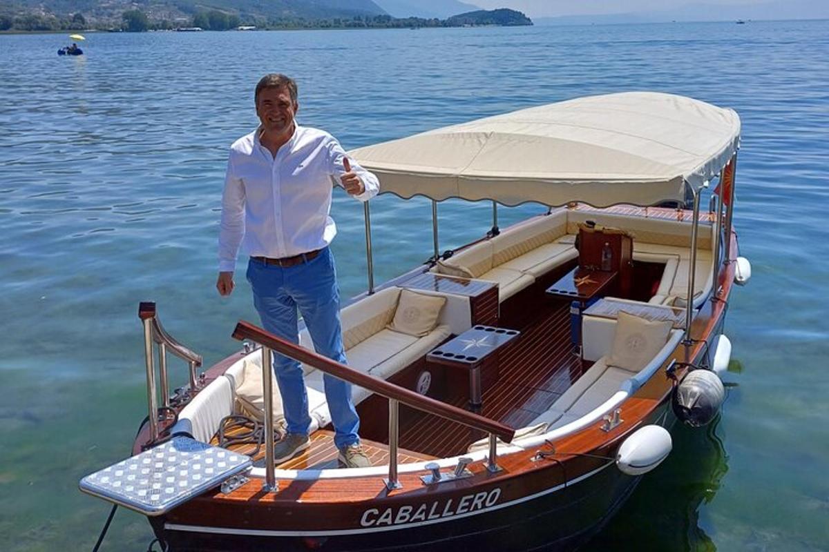 a man standing on a boat in the water