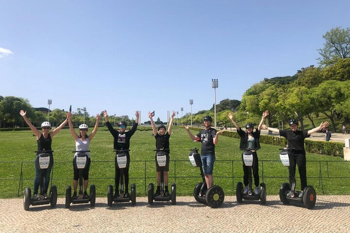 a group of people riding on segways in a park