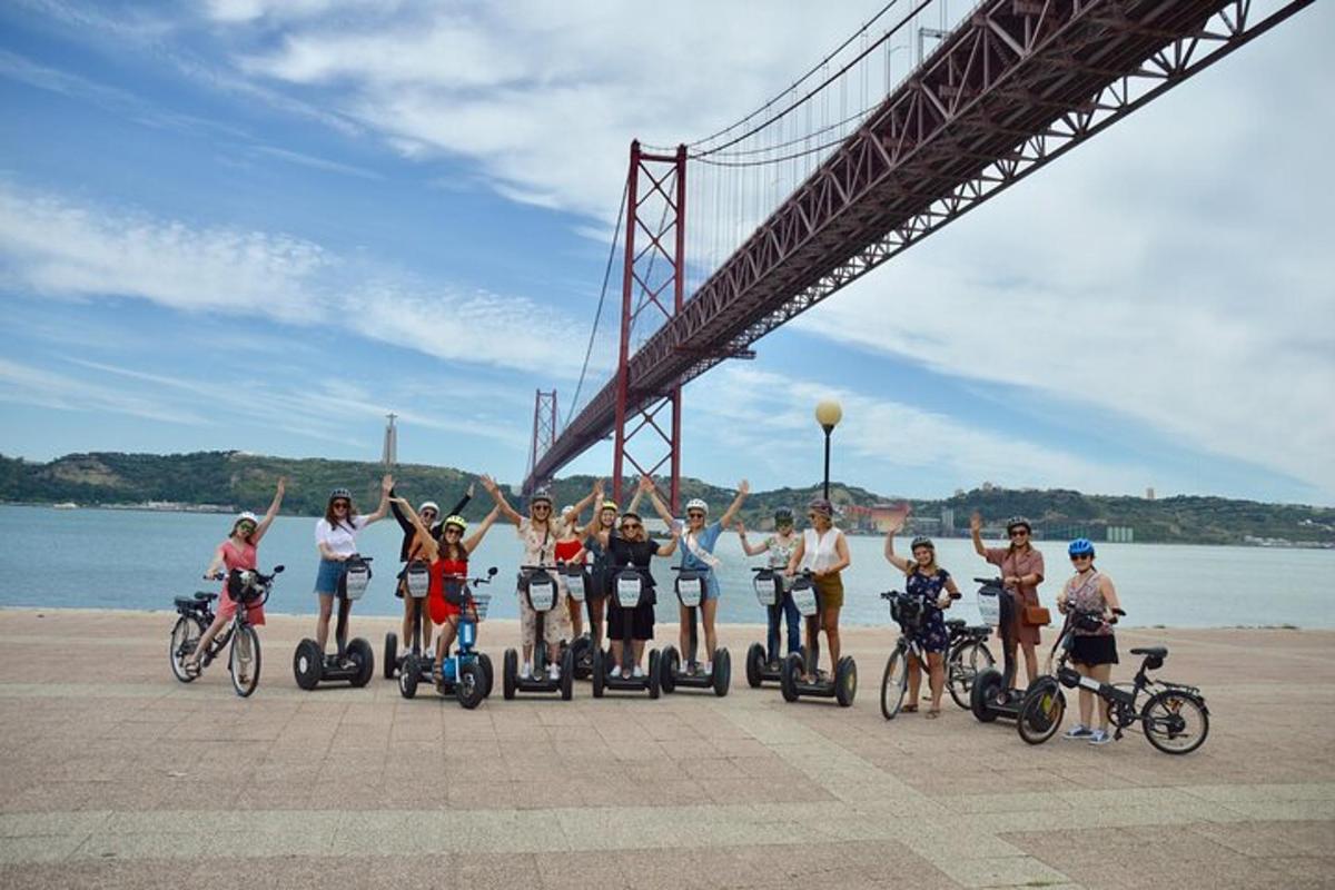 a group of people riding bikes under a bridge
