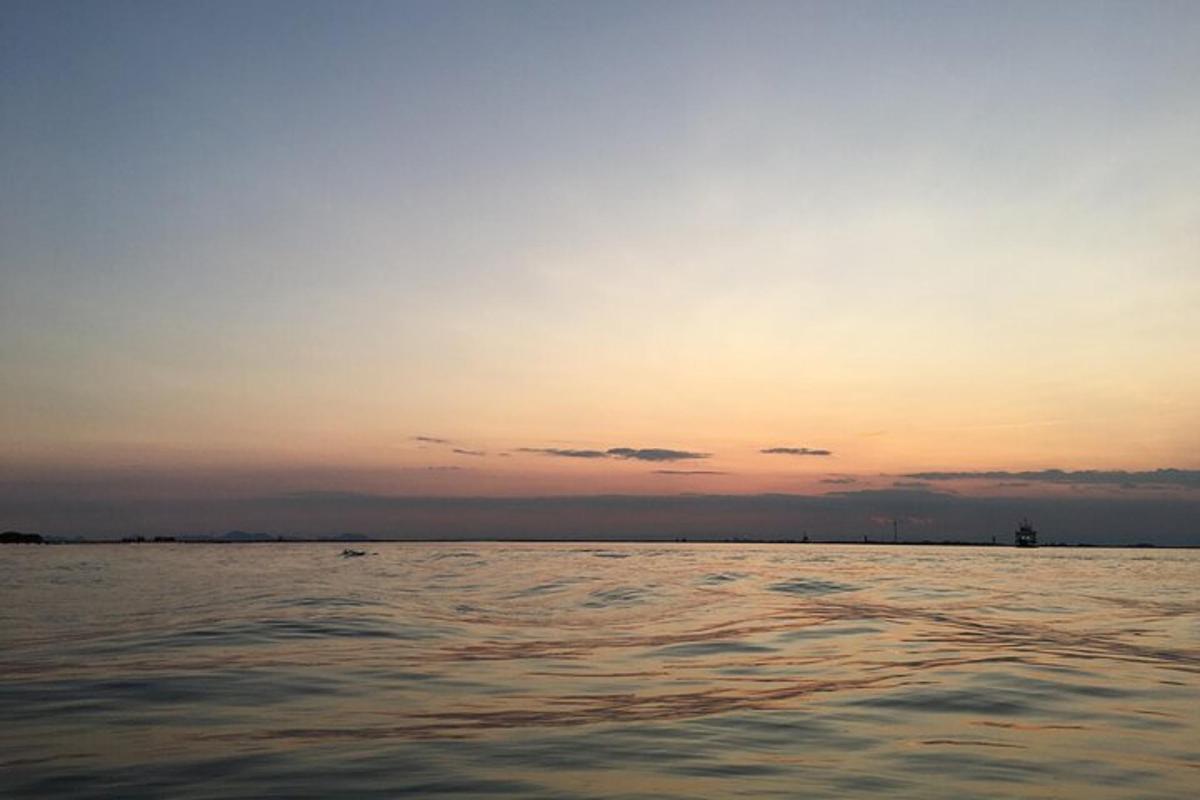 a view of the ocean at sunset
