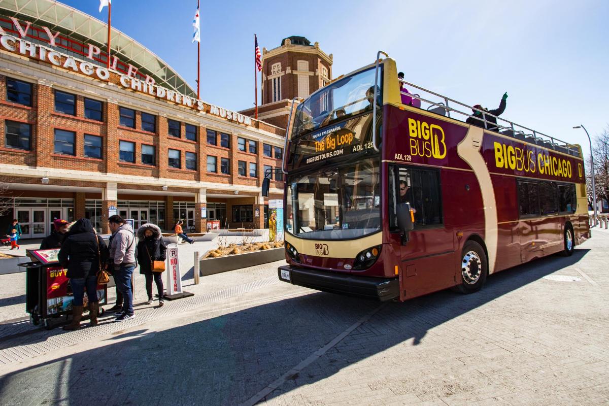 a double decker bus parked in front of a building