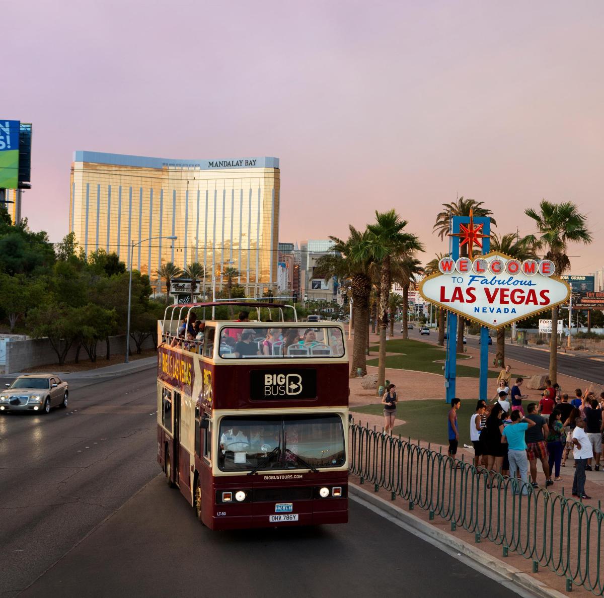 a double decker bus driving down a city street