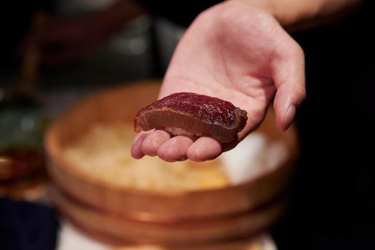 a person holding a chocolate bar in their hand