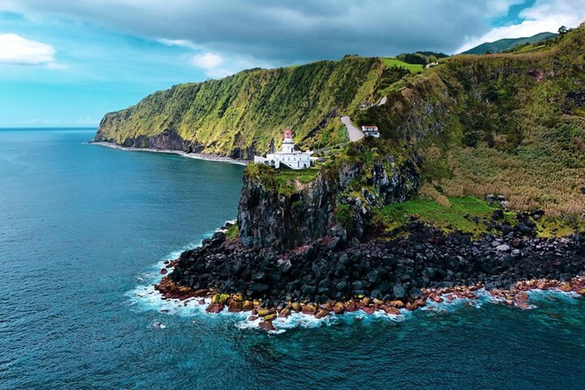 an island in the ocean with a lighthouse on it