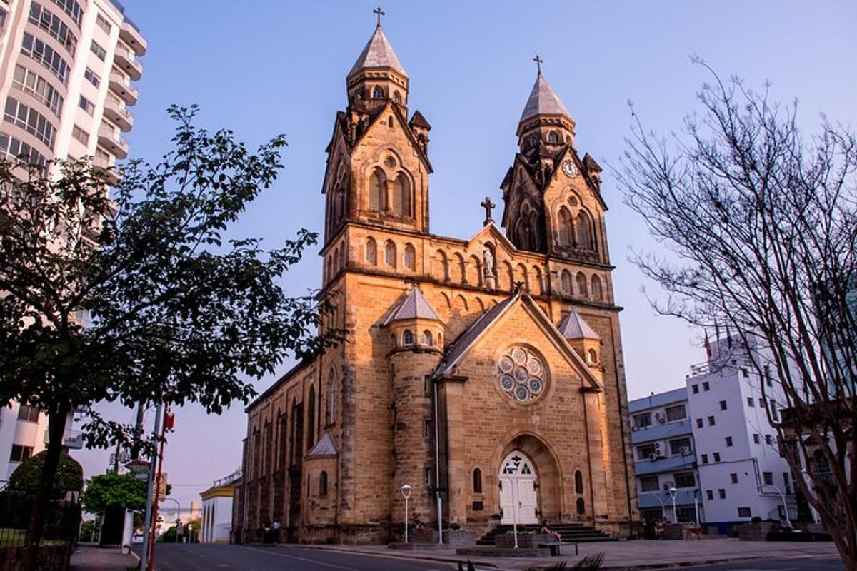 a church with two towers with a clock on it